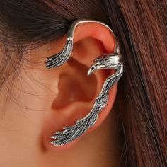 This Single Crow Bird Ear Hugging Ear Cuff If For The Left Ear And Is A Fun Addition To Your Wardrobe And Your Style! This Fun Unique Piece Has A Nice Shine To It And Is Easy To Wear! Requires Only A Single Standard Lobe Piecing And The Top Wing Wraps Around The Top Of Your Ear Without Any Additional Piercing. Gsumph50600j104 Bird Ears, Skull Fire, Boho Drop Earrings, Ear Cuff Jewelry, Crow Bird, Ear Climbers Earrings, Ear Climber, Ear Earrings, Cuff Jewelry