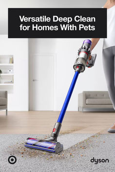 a person using a vacuum to clean the floor