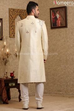 Latest Pakistani Cream Sherwani for Groom Online in Stylish design embellished with resham, dabka, zardosi work. This ethnic sherwani contains kora, dabka work and darker hues. Sherwani: The unique style of dressing the groom should be exceptional on wedding day the cream colored raw silk wedding sherwani has the zardosi, resham and zari embroidery overall the surface of the sherwani and delivers the enriched looks. Wedding sherwani which gives traditional look with trendy touch. This is the per Hawler Kurdistan, Cream Sherwani, Sherwani For Groom, White Churidar, Dabka Work, Sherwani Groom, Zardosi Work, Mens Sherwani, Wedding Sherwani