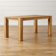 a wooden table sitting on top of a hard wood floor