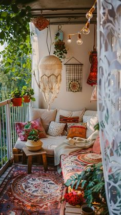 the balcony is decorated with plants and rugs