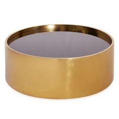 a round gold metal tray with a black glass in the center on a white background