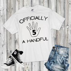 a t - shirt that says officially a handful with an image of a pair of sneakers