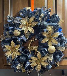 a blue and gold wreath on the front door