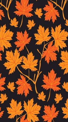 an orange and black background with leaves