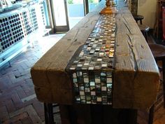 a long wooden table sitting in the middle of a room