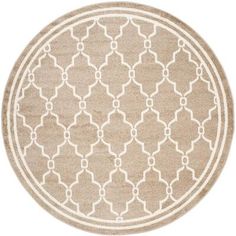 a beige and white rug with an intricate design in the middle on a white background