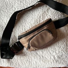 Tan And Black Crossbody/Bum Bag. Nwot Adjustable Strap To Use As Crossbody Or Belt Bag. Zippered Pocket On Front Of Bag I.D And Card Pockets On Inside Casual Beige Belt Bag For On-the-go, Functional Beige Belt Bag With Zipper, Versatile Beige Belt Bag With Zipper Pocket, Functional Beige Crossbody Belt Bag, Functional Beige Belt Bag With Pockets, Functional Beige Belt Bag For On-the-go, Functional Beige Belt Bag With Cell Phone Pocket, Beige Belt Bag With Zipper Pocket For On-the-go, Trendy Beige Belt Bag With Zipper Pocket