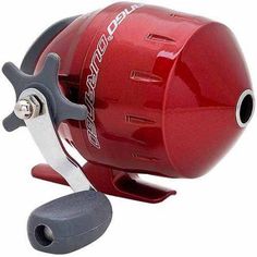 a close up of a red fishing reel on a white background with clippings