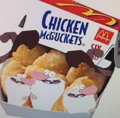 an open box of chicken mcoutets with cartoon characters on them