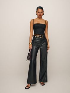 We make pants too. Shop the Veda Kennedy Wide Leg Leather Pant from Reformation,  a high rise wide leg jean with a loose fit, zip fly closure, and side pockets. Black Pants Night Out Outfit, Wide Leg Pants Outfit Party, Club Outfits For Women Jeans, Cute Outfits With Leather Pants, Pants Leather Outfit, Leather Wide Leg Pants Outfit, Wide Leg Leather Pants Outfit, Wide Leg Leather Pant, Leather Pant Outfits