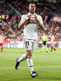 a soccer player is applauding the crowd