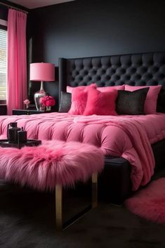 a bedroom with black walls, pink bedding and fur rugs on the floor