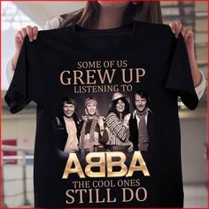 Some Of Us Grew Up Listening To Abba T Shirt Hoodie Sweater available in T-shirt, hoodie, tank top, longsleeve, multi color and size S M L XL XXL 3XL 4XL 5XL. Shipping from the US. Easy 30 day return policy - Shop now! 6.1-ounce, 100% cotton .Double-needle neck, sleeves and hem; Roomy Unisex Fit. Ash is 99% cotton, 1% poly; Sport Grey is 90% cotton, 10% poly; Dark Heather is 50% cotton, 50% polyester .Decoration type: Digital Print. Made by Gildan Abba T Shirt, Abba Tshirt, Abba Band, 3d Clothes, Iconic Album Covers, Band Hoodies, Shirt Designs For Men, T Shirt Printing, The Cool