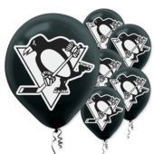 black and white party balloons with penguins on the front, one penguin is holding a hockey stick