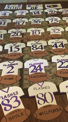 the table is covered with signs and numbers for each team's name or number