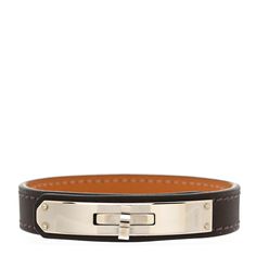 This is an authentic HERMES Chamonix Kelly Single Tour Bracelet S in Ebene. This stylish bracelet is crafted of brown smooth calfskin leather with palladium hardware including a Kelly style faux turn lock. Hermes Bracelet, Hermes Jewelry, Stylish Bracelet, Calf Skin, Bracelet, Leather