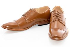 Elegant broguing outlines a vintage cap-toe design in this derby shoe featuring professional stylings and a handsome silhouette atop a flexible sole. Tan Wedding Shoes, Cap Toe Dress Shoes With Goodyear Welt For Derby, Brown Cap Toe Lace-up Shoes For Derby, Fitted Cap Toe Oxfords For Derby, Cap Toe Oxfords For Derby, Fitted Cap Toe Dress Shoes For Derby, Cap Toe Derby Shoes With Brogue Detailing, Business Casual Cap Toe Derby Shoes, Groomsmen Shoes