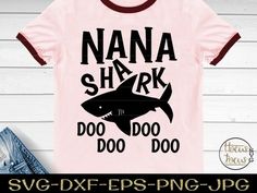 a pink shirt that says mommy shark do doo doo with a black shark on it