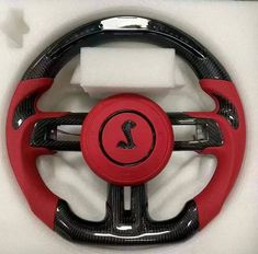 the steering wheel cover is red and black