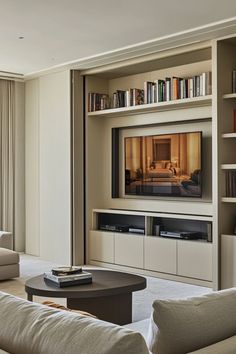 a living room filled with furniture and a flat screen tv