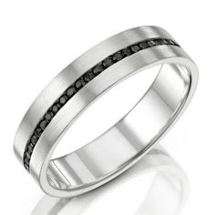 a white gold ring with black diamonds