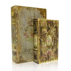 an old book is opened to reveal the pages and features floral designs on it,