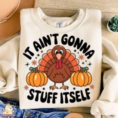 a white shirt with a turkey on it that says i'm anti goma stuff itself