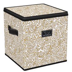 the large storage box is decorated with gold and white paisley print, which has black handles