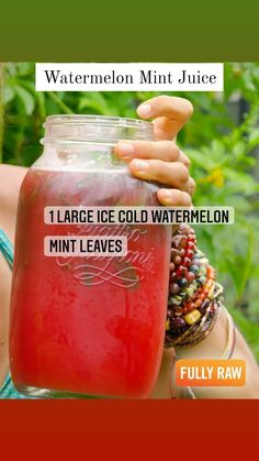 a woman holding up a large jar filled with watermelon and ice cold watermelon