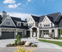 a large house with lots of windows and white trim