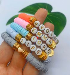 Colorful heishi disc beads name bracelet! Please select your length and bead color. Comes with gold plated beads also. Bead colors available are white with gold, black with white or white with black. Thanks for stopping in! :) Handmade Heishi Beads Name Bracelet For Everyday, Custom Name White Heishi Beads Jewelry, Personalized Gold Heishi Beads Stretch Bracelet, Personalized Gold Heishi Beads Bracelets, White Name Bracelet With Letter Beads And Heishi Beads, Custom Name White Heishi Beads Bracelets, Beads Name, Friendship Bracelets With Beads, Custom Bracelet