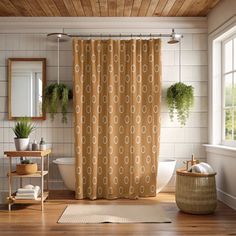 a bathroom with a shower curtain, toilet and sink in it's center area