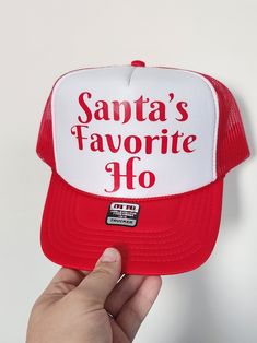 Elevate your holiday spirit and add a dash of fun to your winter wardrobe with our festive Holiday Truckers Hat! This one-of-a-kind accessory is the perfect blend of style and comfort, making it a must-have for all your seasonal adventures. 🎄 Handcrafted with Love: Each holiday trucker hat is meticulously crafted with attention to detail. Our team of skilled artisans ensures that you receive a high-quality product that you'll be proud to show off during the holidays. 🌟 Unique Design: Our holiday-themed trucker hat features a unique and eye-catching design that encapsulates the magic of the season. Whether you're hitting the slopes, gathering around the campfire, or just running errands, this hat will keep you in the festive spirit. 🧢 Comfortable Fit: Made with premium materials, our tru White Snapback Trucker Hat For Winter, Winter Party Hat With Fun Style, Fun Red Trucker Hat With Letter Print, White Christmas Hat As Gift, Red Winter Hat As A Gift, Novelty Red Trucker Hat, Red Winter Hats For Gifts, Casual White Christmas Hat, White Christmas Holiday Hat