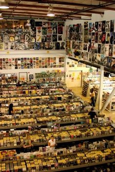 an overhead view of a store filled with lots of items and people looking at them