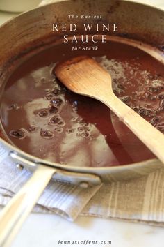 red wine sauce in a pot with wooden spoon