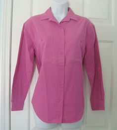 Women's 1960's or 70's Vintage LEE Bright Dark Pink long sleeve shirt in size S (8-10).  Shirt buttons down front, has collar with V-neck, 2 breast pockets with buttons, button sleeve cuff, and shirt tail bottom.  Polyester/cotton blend that is  Machine Washable.   Measurements lying flat:    Pit to Pit 19 1/2" Length from shoulder to bottom of shirt 26" Shoulder seam to bottom of sleeve 20 1/2" Shoulder seam to shoulder seam across top back 18" If you have an interest in this item and would like additional pictures or more information, please email me and I will respond ASAP SMOKE FREE - PET FREE - CLEAN HOME International buyers please note that import duties, taxes, and charges are not included in the item price or shipping cost. These charges are the buyer's responsibility. Please chec Affordable Pink Shirt With Button Cuffs, Cheap Pink Shirt With Button Cuffs, Pink Long Sleeve Shirt, Sleeve Cuff, Pink Shirt, Dark Pink, Womens Clothing Tops, 1960s, Blouses For Women