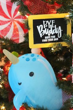 an ornament on a christmas tree with candy canes and candies in the background