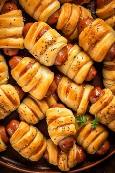 hotdogs wrapped in bread and sprinkled with pepper