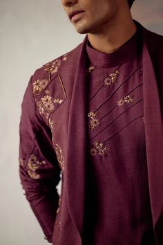 Wine bundi jacket with placement floral hand-embroidery. Paired with embroidered kurta and matching tapered trousers.
Component: 3
Pattern: Embroidered
Type Of Work: Floral
Neckline: Jacket: Open
Sleeve Type: Kurta: Long
Fabric: Linen Silk
Color: Wine
Other Details: 
Embroidered jacket
Floral motifs
Occasion: Sangeet,Wedding - Aza Fashions Fitted Kurta With Floral Embroidery For Fall, Fitted Floral Embroidered Kurta For Fall, Fall Floral Embroidered Straight Kurta, Designer Chikankari Embroidered Kurta For Fall, Fall Festive Kurta With Intricate Embroidery, Embroidered Designer Wear Sets For Fall, Embroidered Fall Designer Wear Sets, Embroidered Fall Designer Sets, Fall Embroidered Sets