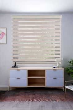 a living room with a large window covered in shades of white and light blue blinds