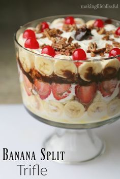 a banana split trifle dessert in a glass dish