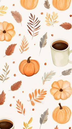 a cup of coffee sitting on top of a table next to leaves and pumpkins