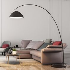 a modern living room with an arc floor lamp