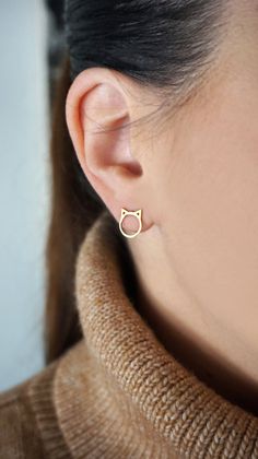 14K 9K Gold Cat Ears Studs, Small Cat Stud Earrings, Kitten Studs, Minimalist Cat Earrings, Animal Lover Gift, Simple Solid Gold Earrings, FREE EXPRESS SHIPPING Adorable pair of small cat ears stud earrings made in 14K or 9K solid gold. Mix and match with other studs: https://www.etsy.com/shop/WhisperGold?section_id=23760296 ------------------------------------------------- D E T A I L S 14K or 9K Solid Gold Size: 11mmx 9.5mm Earrings for pierced ears with butterfly closure Earrings are sold as Gold Cat Ears Jewelry As Gift, Gold Cat Ears Jewelry Gift, Gold Cat Ears Jewelry For Gifts, Gold Cat Ears Jewelry For Gift, Cat Stud Earrings, Crescent Moon Necklace Gold, Double Horn Necklace, Good Luck Necklace, Gold Horns