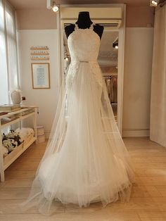 a wedding dress on display in a store