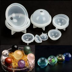 several different types of glass bowls with lids and spoons next to each other on a black surface