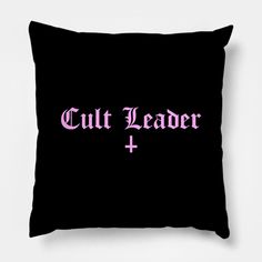 a black pillow with the words cult leader and pink lettering