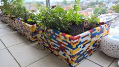 three planters are made out of legos