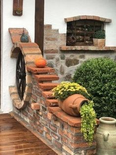 an outdoor area with potted plants and stone steps